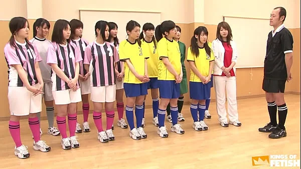 Japanese female team listen and take a lesson from their coach